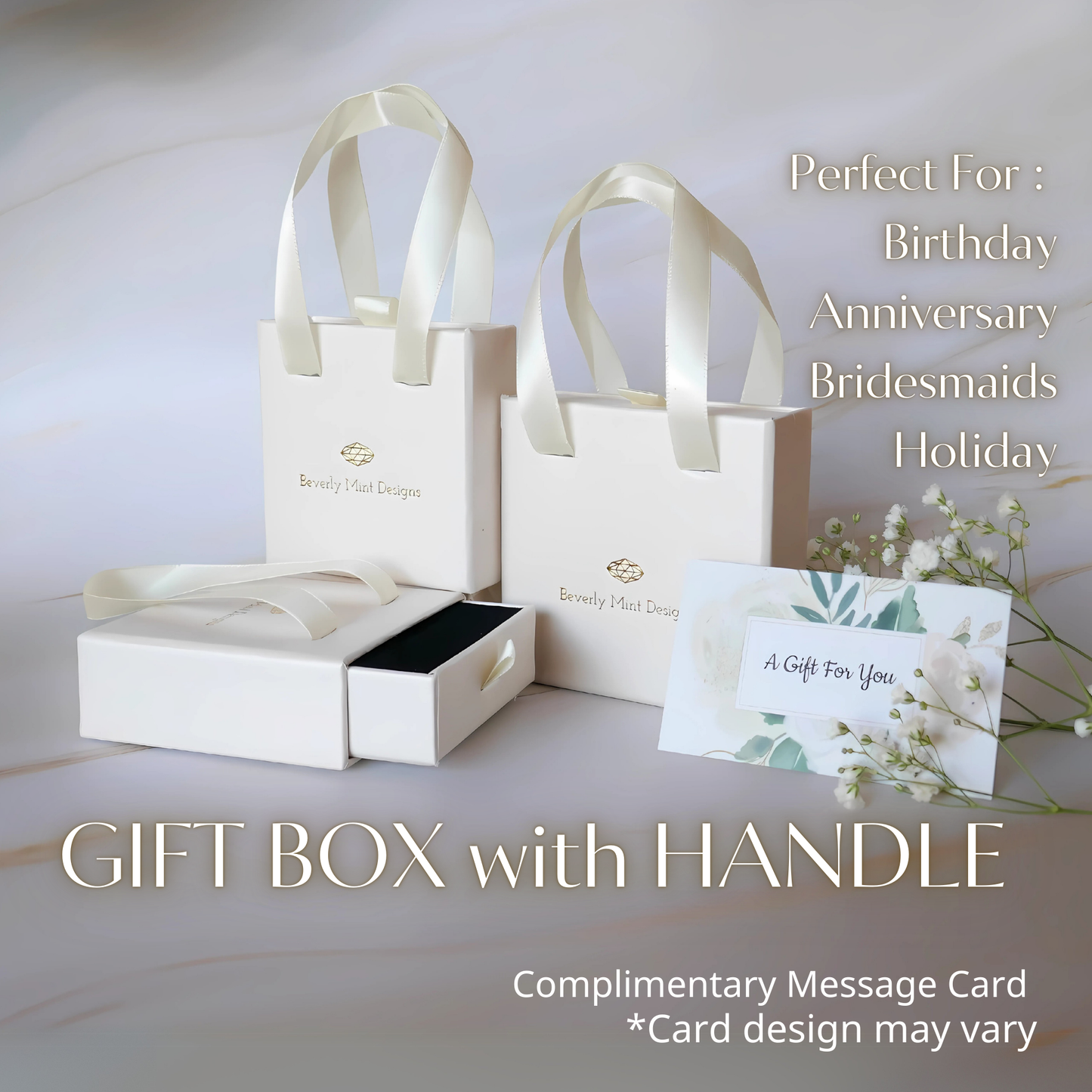 a gift box with a handle, accompanied by a gift card and a complementary message card.