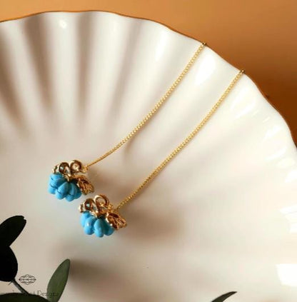 a close up of a plate with two necklaces on it