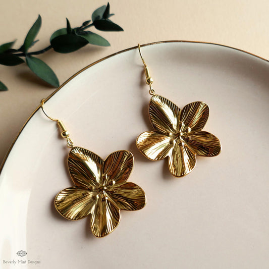 Gold Plumeria Earrings, Tropical Flower Earrings with Heft, Elegant Blossom Dangles, Sensitive Ear & Clip-On Options